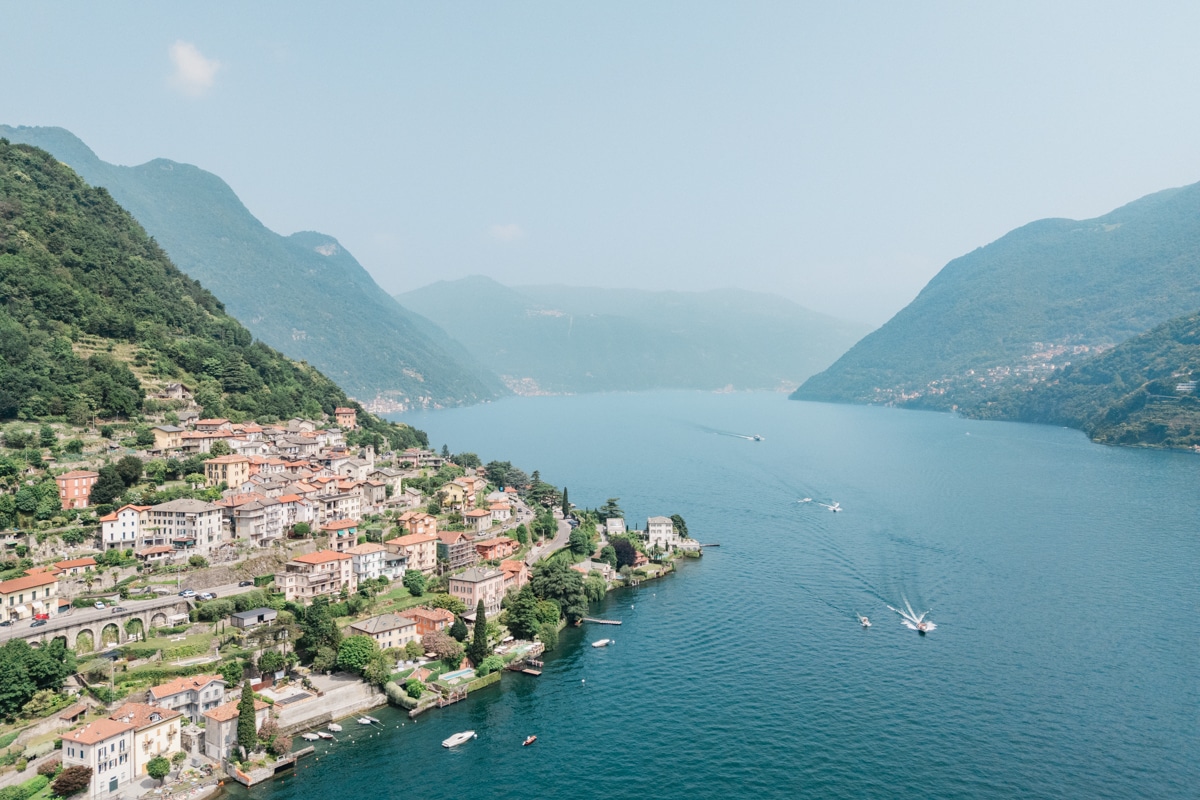Scenic view of Lake Como with mountains and villas along the shoreline, Italy