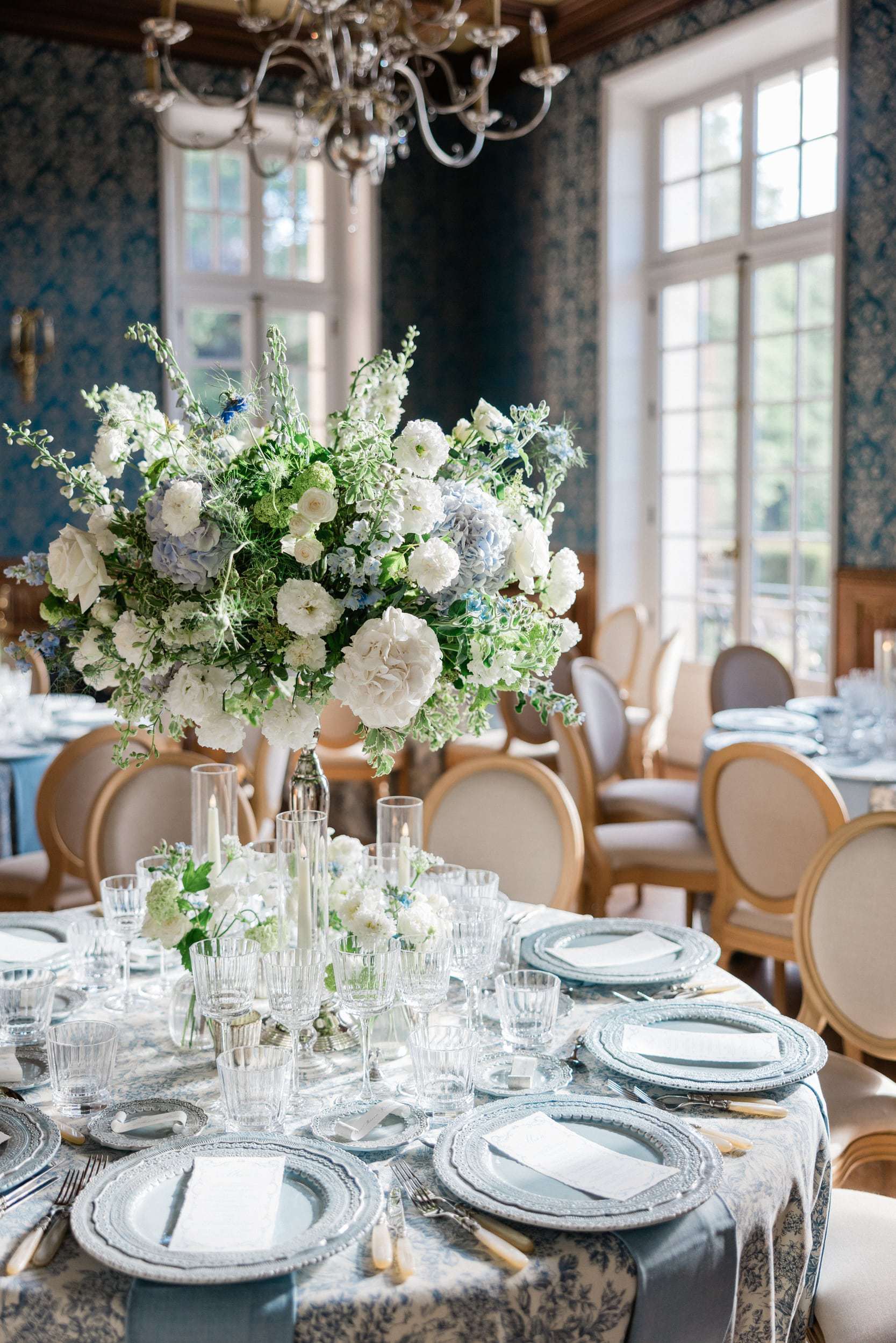 Refined tablescape and floral design at an elegant French château wedding