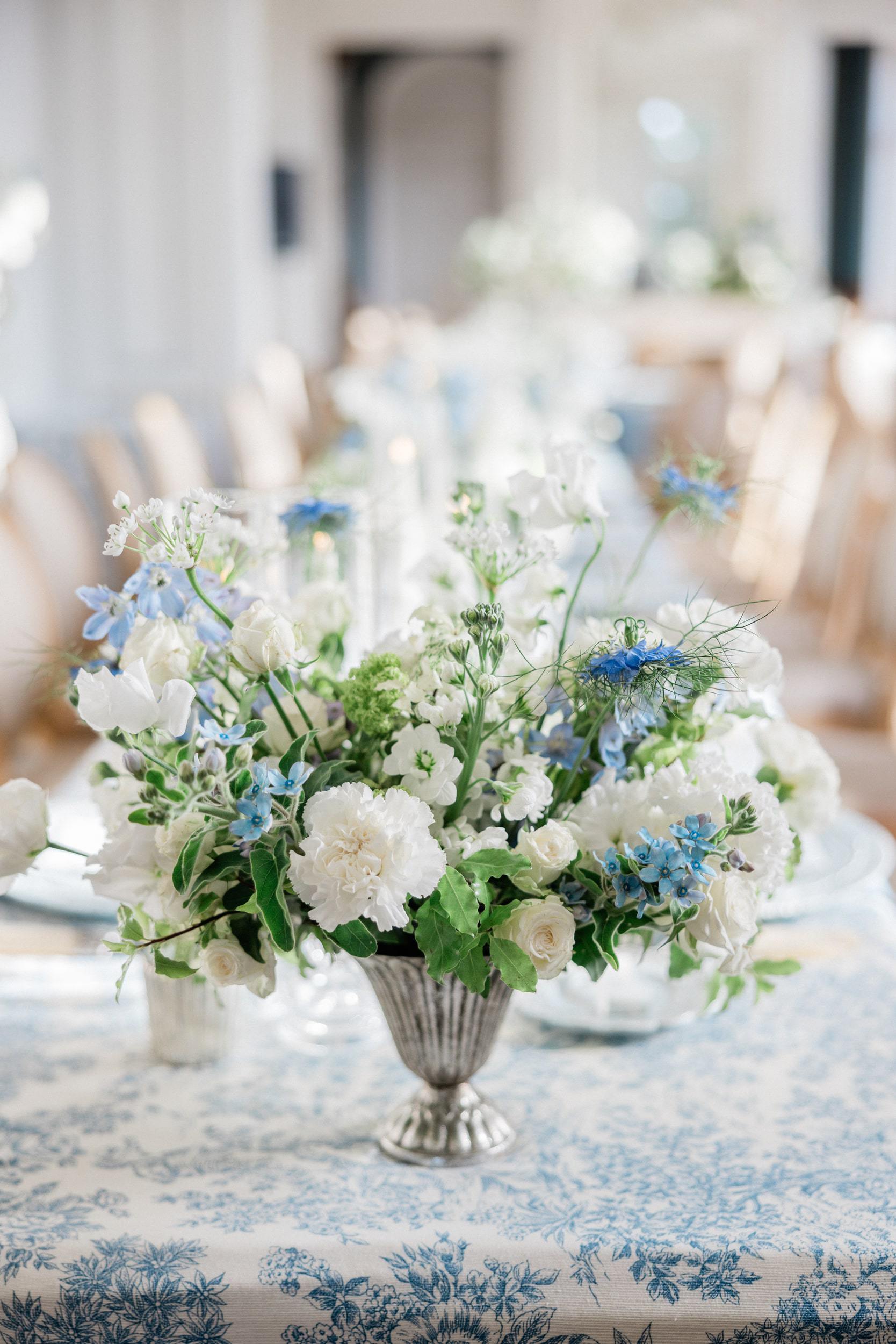 Wedding tables and floral arrangements inside an elegant French château