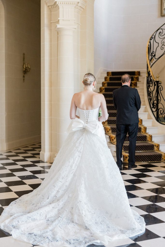 Bride and father during an emotional first look at a French château