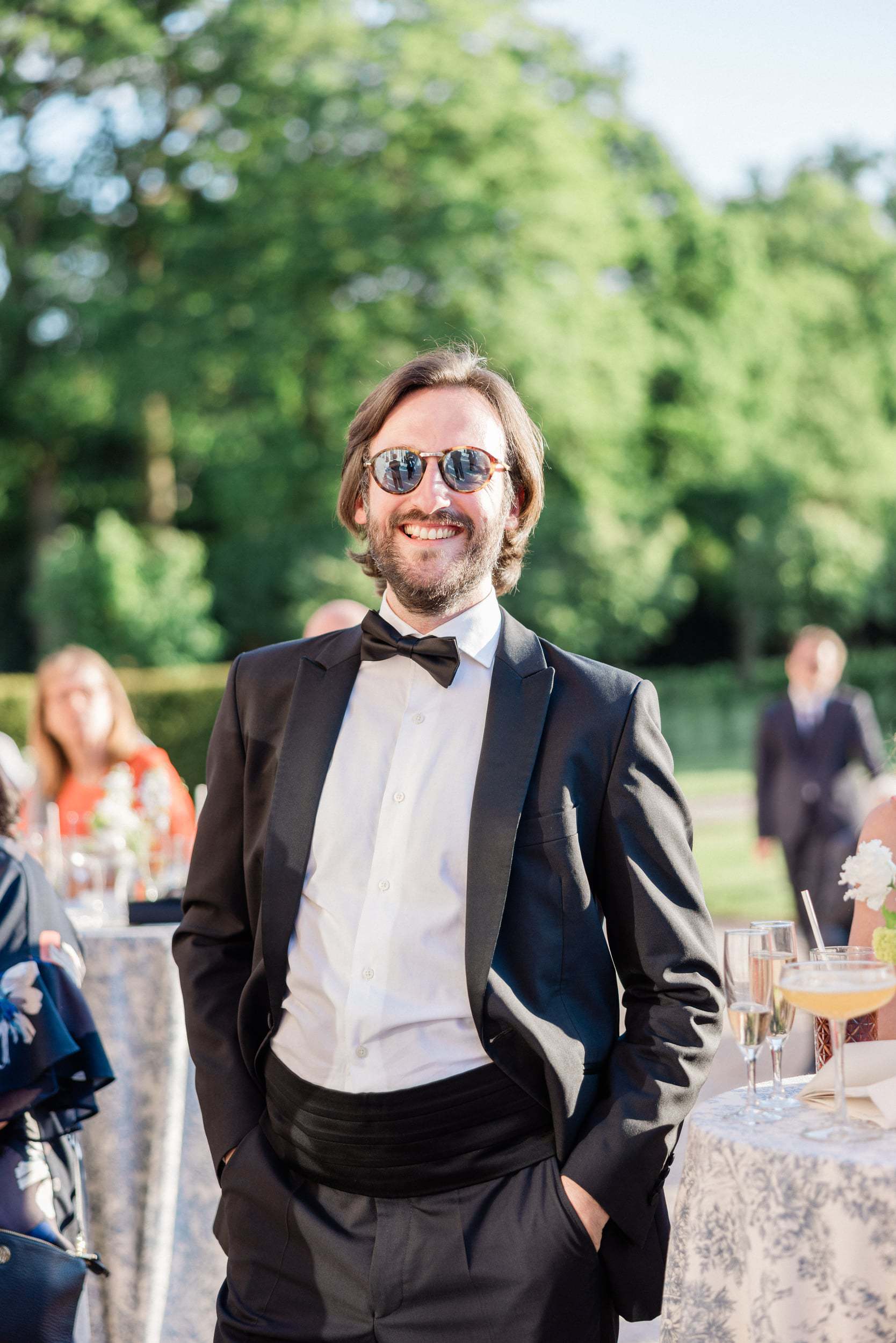 Guest enjoying a joyful moment at an elegant French château wedding