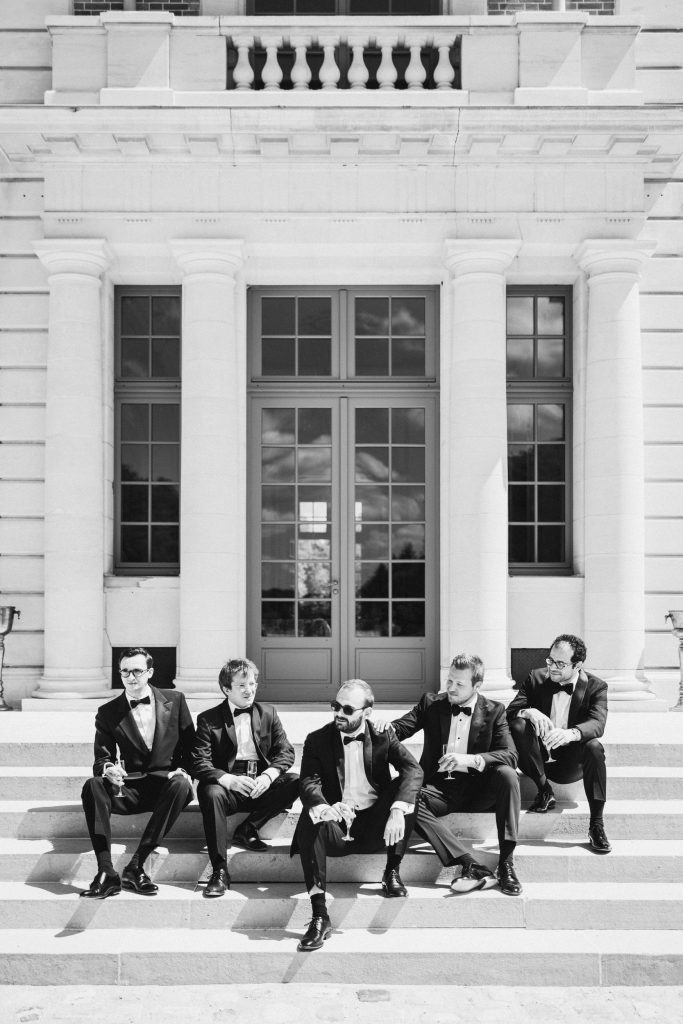 Editorial portrait of the groom and his groomsmen at a French château wedding