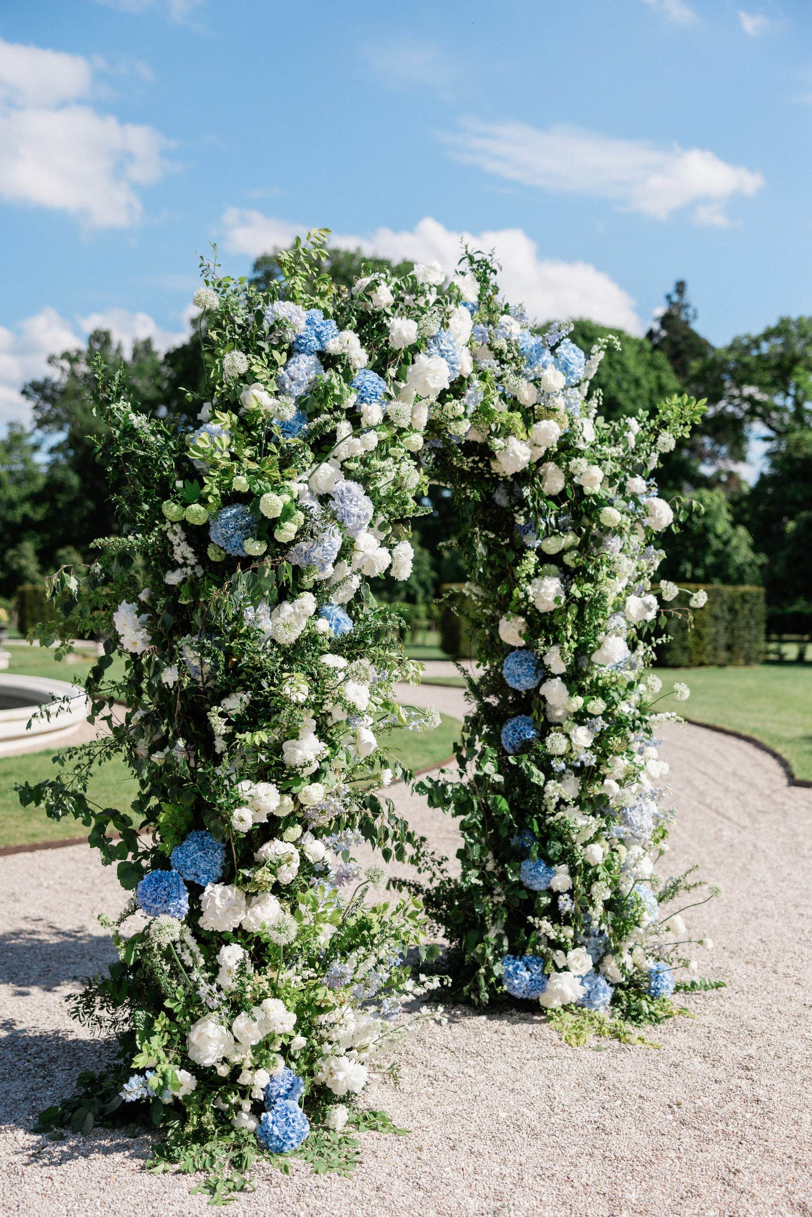Elegant floral wedding arch at Château de Nainville-les-Roches