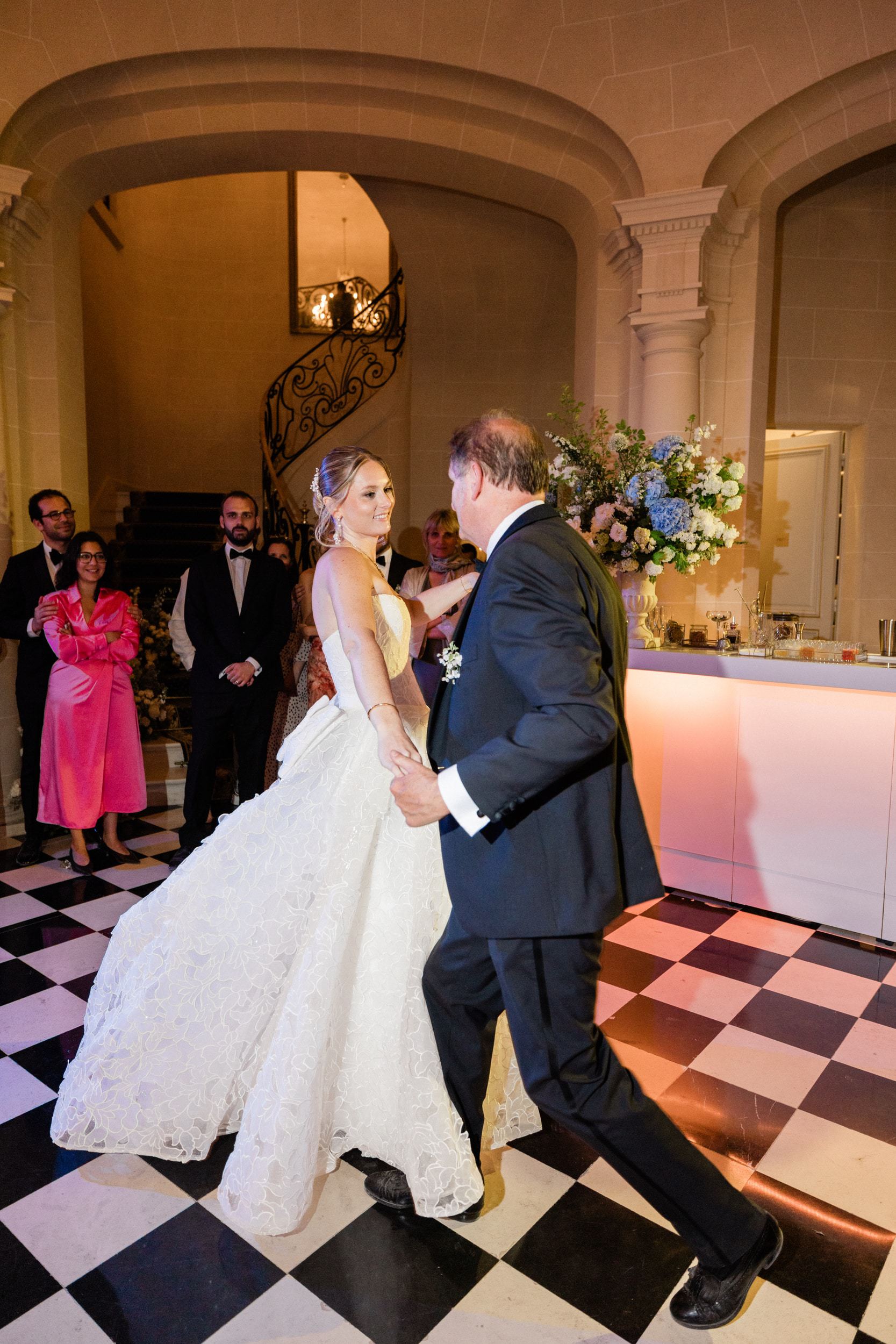 Bride and groom celebrating with their guests during the evening reception