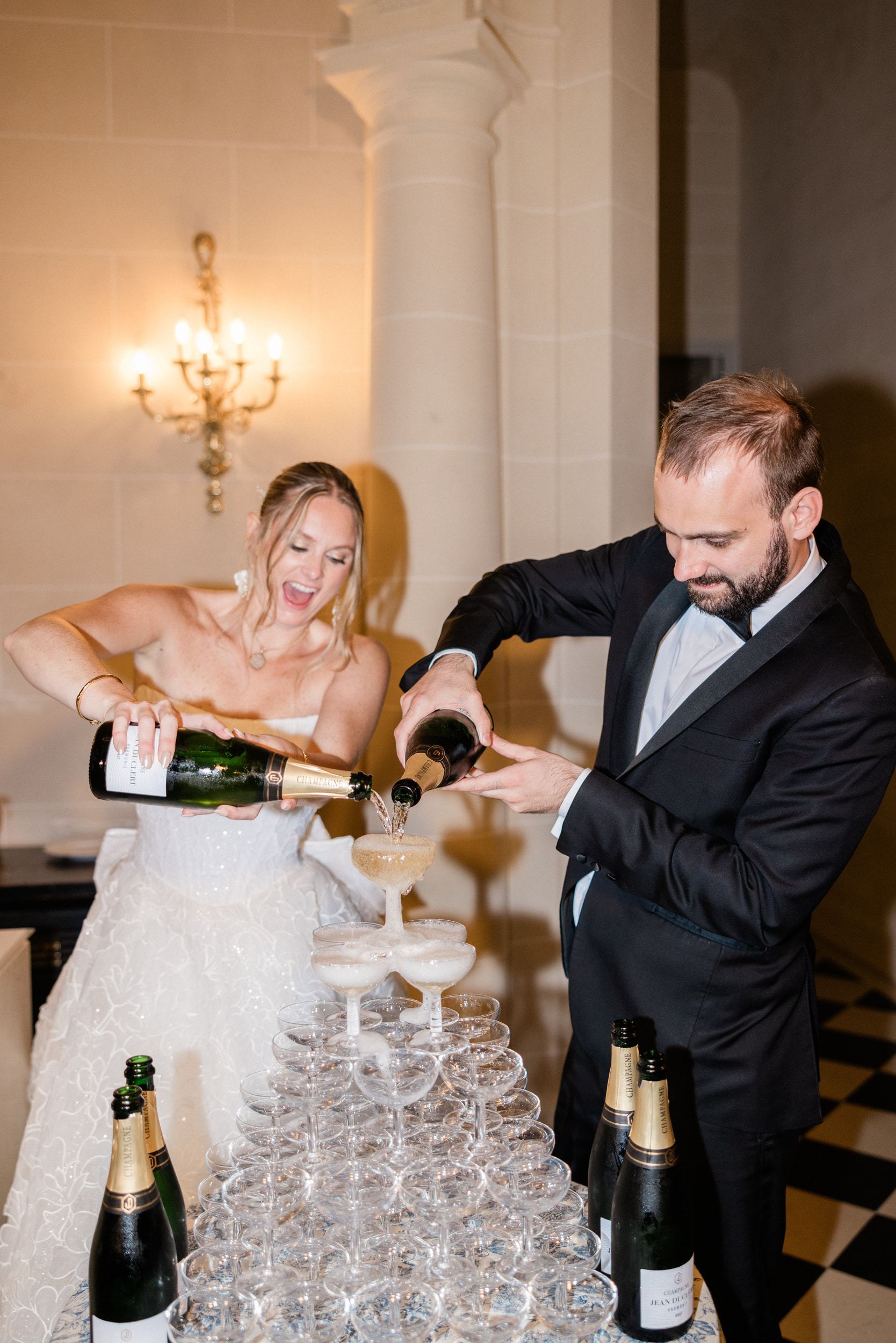 Champagne tower at an elegant French château wedding reception
